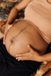 Photo of pregnant woman reclining in chair